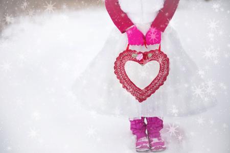 Person in Pink White Dress Holding Red Heart Purse