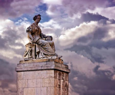 Person in White Dress Ceramic Statue Under Blue Cloudy Sky during Daytime