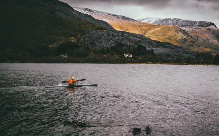 Person Kayaking on Body of Water