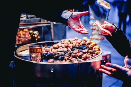 Person Paying Bill in Front of Nuts