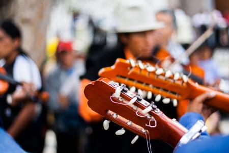 Person Playing Guitar During Daytime