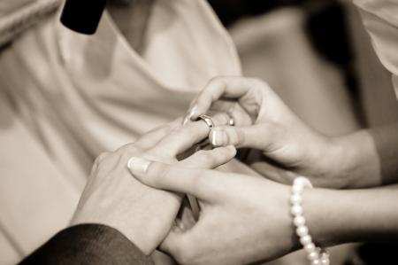 Person Putting Ring on Another Person in Grayscale Photography