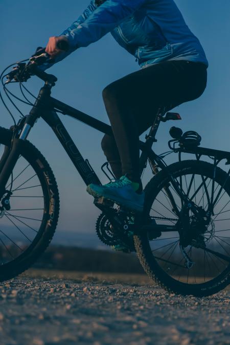 Person Riding on Black Mountain Bike during Night Time