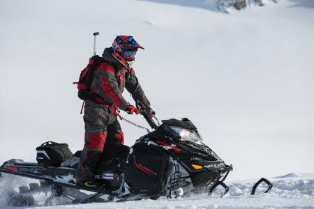 Person Riding on Snowmobile