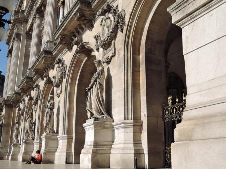 Person Sitting Beside Beige Concrete Church