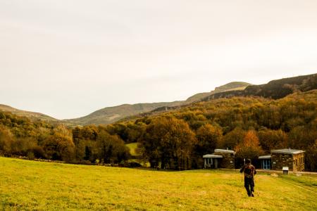 Person Standing at Green Field