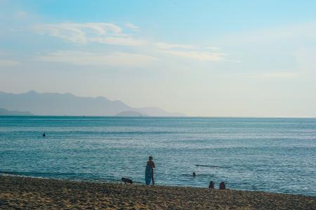 Person Standing on Seashore