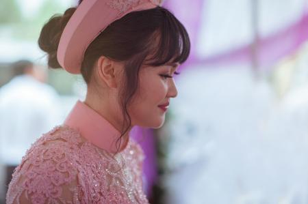 Person Taking Photo of Black Haired Woman in Pink Floral Dress in Tilt Shift Photography