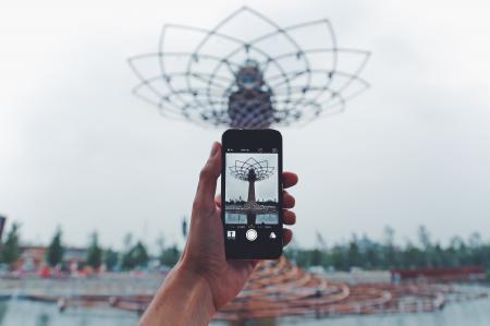 Person Taking Photo of Tower