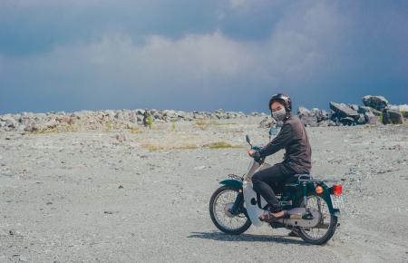 Person Wearing Mask on Motorcycle