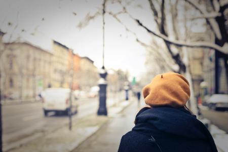 Person With Brown Hat Walking on Street