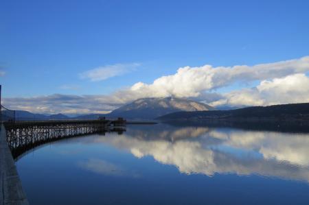 Photo of Black Bridge on Body of Water