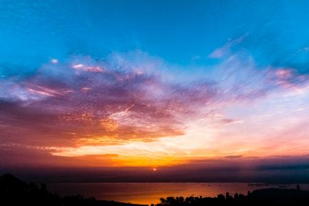 Photo of Body of Water Under Blue and Black Golden Sunset