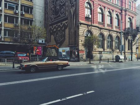 Photo of Brown Convertible Coupe on the Road