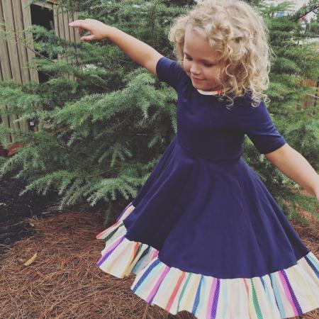 Photo of Girl Wearing Half-sleeved Dress Near Green Leaf Plant