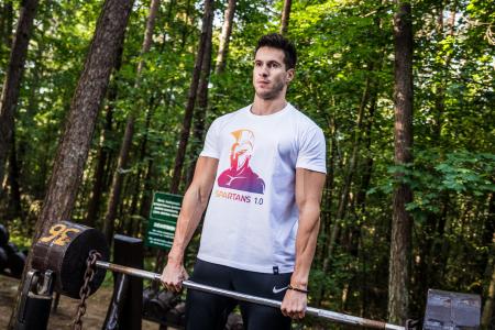 Photo of Man Holding Barbell