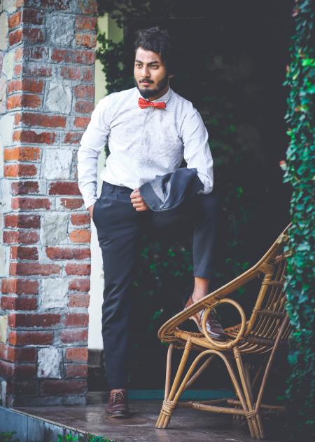 Photo of Man in White Shirt and Black Pants