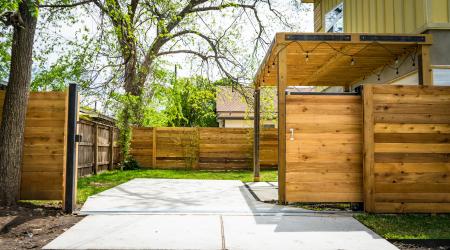 Photo of Opened Brown Wooden Sliding House Gate