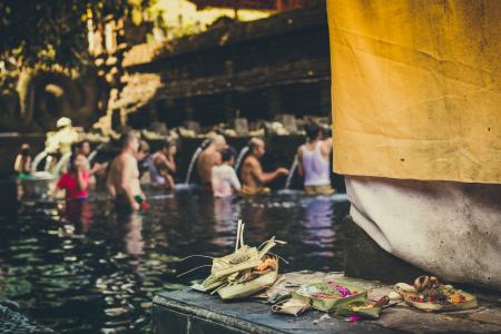 Photo of People in the Body of Water Taking a Bath