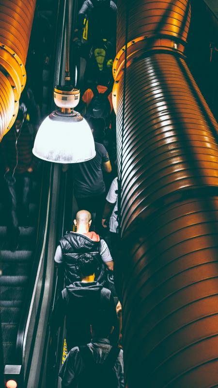 Photo of People Using Escalator Inside a Building