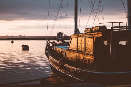 Photo of Ship on Water during Sunset