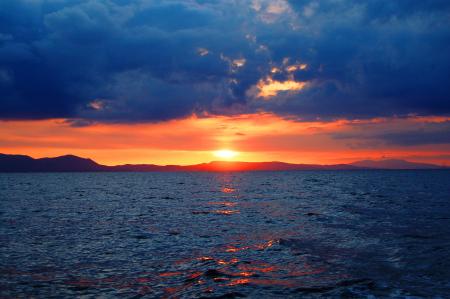 Photo of Sunset over Large Body of Water