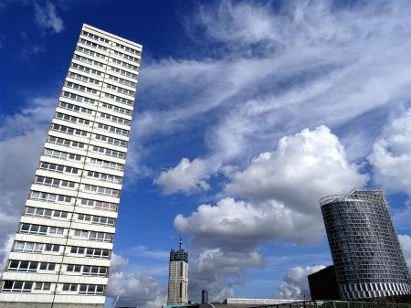 Photo of Two White and Black High Rise Buildings