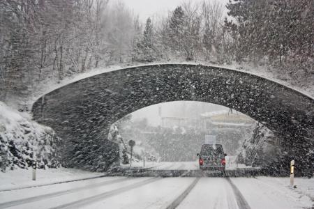 Photo of White Vehicle Crossing a Tunnel