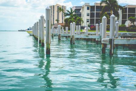 Photo of White Wooden Dock on Body of Water