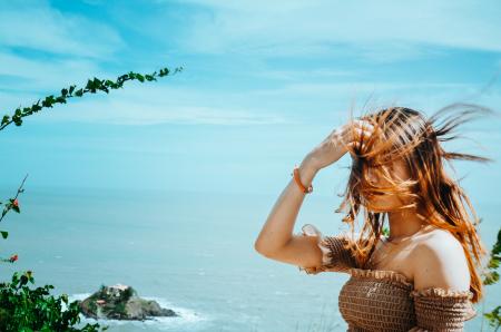 Photo of Woman in Brown Off-shoulder Top