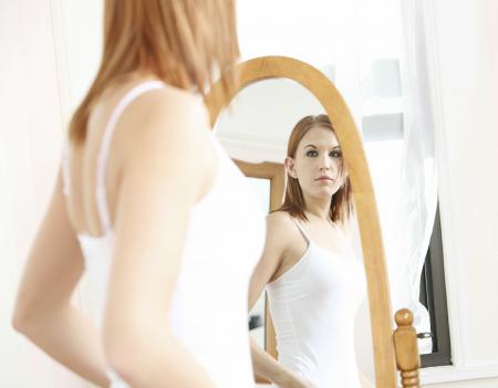 Photo of Woman Looking at the Mirror