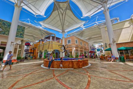 Photo of Woman Sitting Near the Fountain