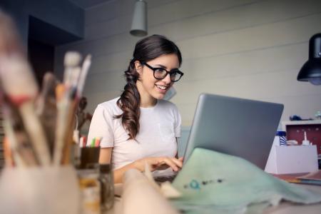 Photo of Woman Using Her Laptop