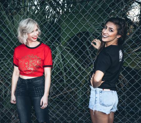 Photo of Women Near Chain-link Fence