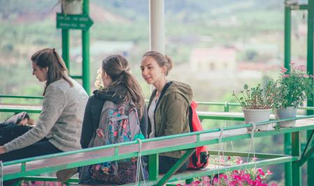 Photo of Women Sitting on Bench