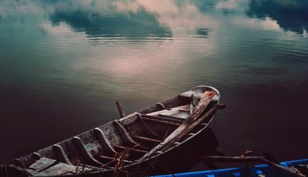 Photo of Wooden Fishing Boat on Water