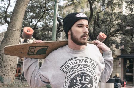 Photography of a Man Holding Longboard