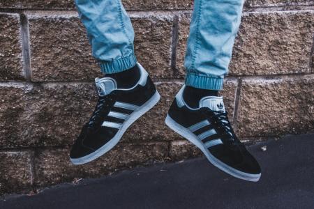 Photography of a Person Wearing Adidas Gazelle