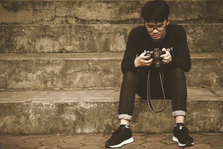 Photography of a Woman Holding DSLR Camera