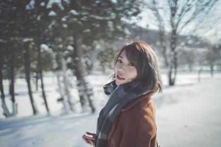 Photography of a Woman Wearing Gray Scarf