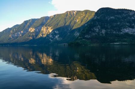 Photography of Body of Water Beside Green Mountain