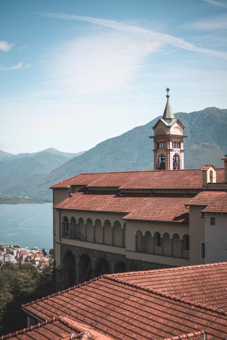 Photography of Concrete Building Near Mountains