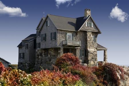 Photography of Grey Concrete House Around the Red Green Leaves Plant Under the Blue Sky