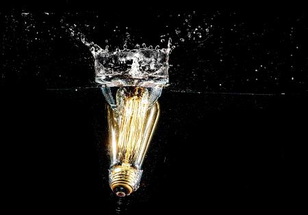 Photography of Light Bulb on Body of Water