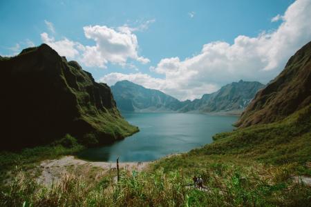 Photography of Mountains Near Body of Water