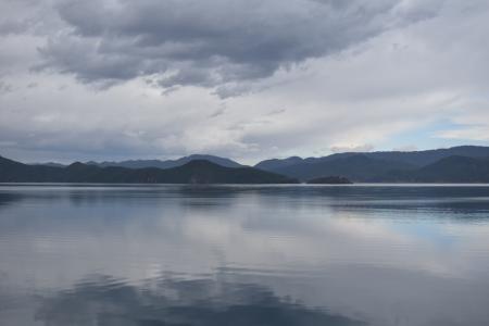 Photography of Mountains Near Body of Water