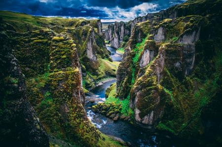 Photography Of Mountains Under Cloudy Skies