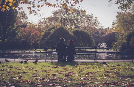 Photography of People Sitting on Bench