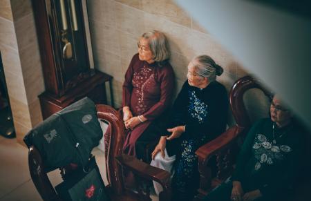 Photography of Three Old Women Sitting on Chair