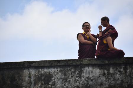 Photography of Three People Talking to Each Other